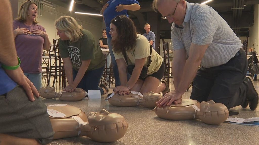 Rochester health leaders train Jazz Fest staff and volunteers in hands-only CPR