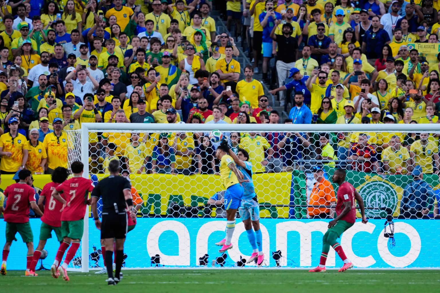 Top Democrats watch Brazil-Morocco match – together